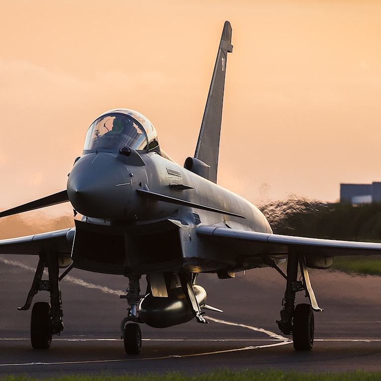 Backlit RAF Typhoon taxis out for takeoff