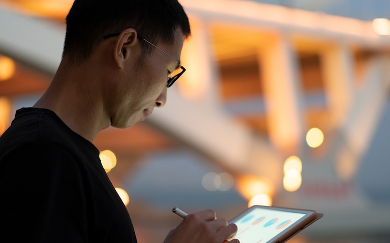 Man looking at a tablet