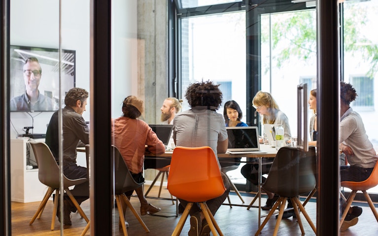 Colleagues sitting in a meeting room