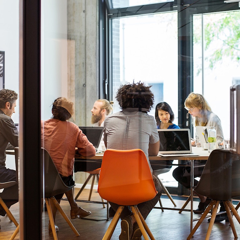 Colleagues sitting in a meeting room