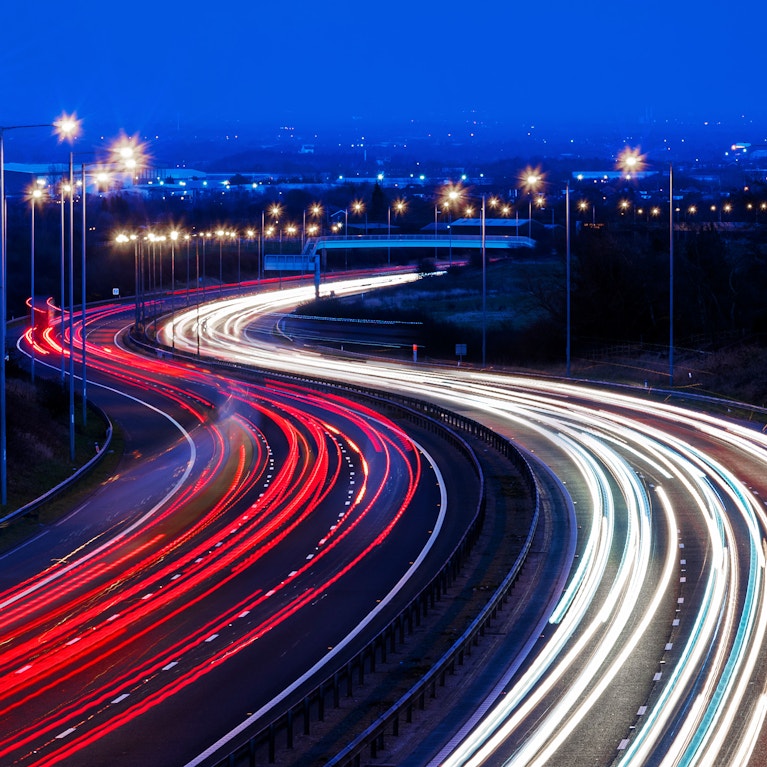 A long highway with night lights