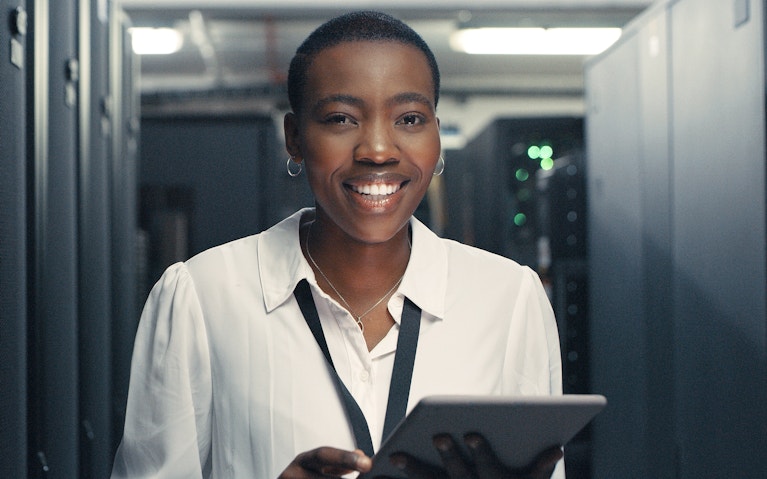 Woman holding ipad.