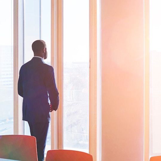 A person looking out an office window