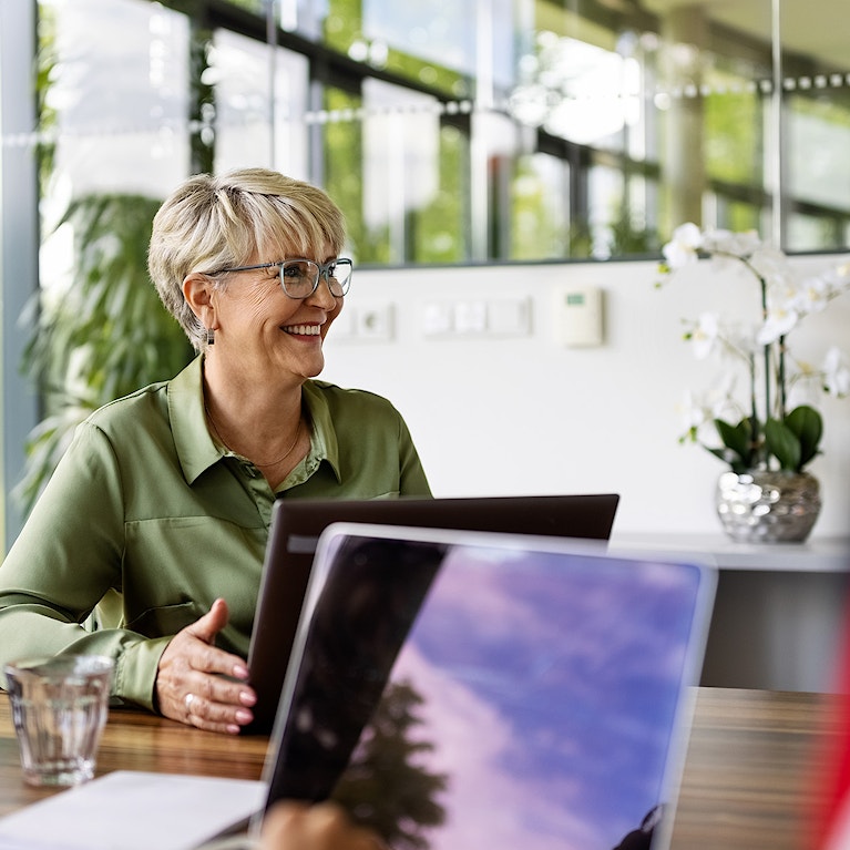 Woman sat at desk.