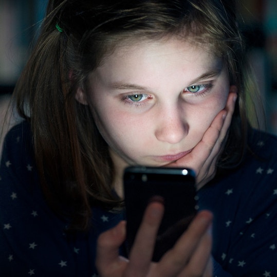 Girl looking at phone.