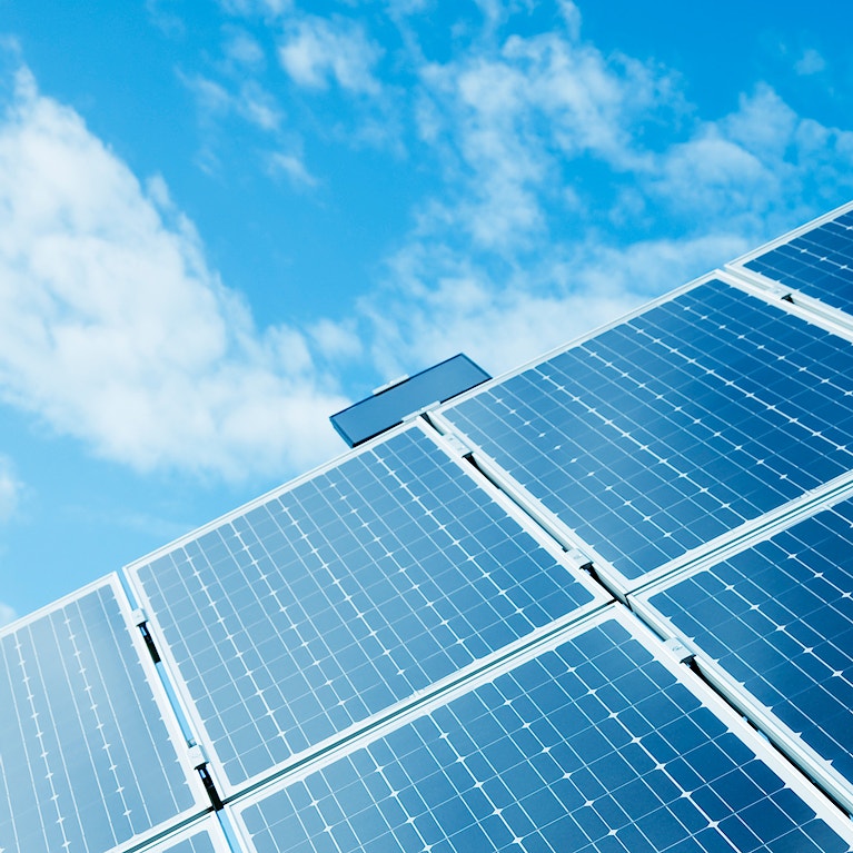 Solar power panels against blue sky