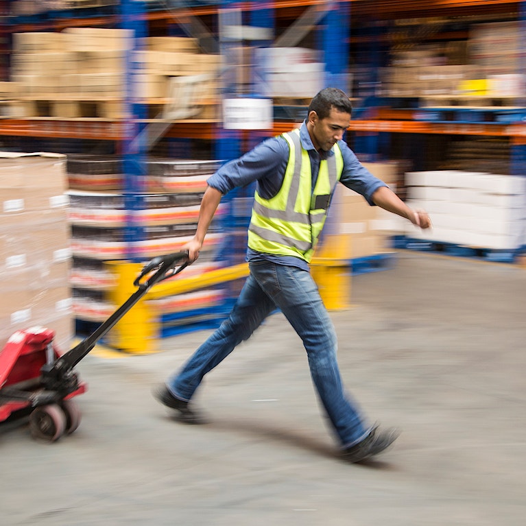 Worker inside a food distribution warehouse