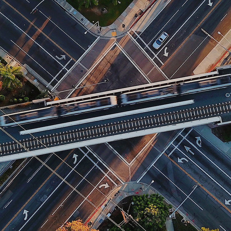 Train on railway bridge over roads