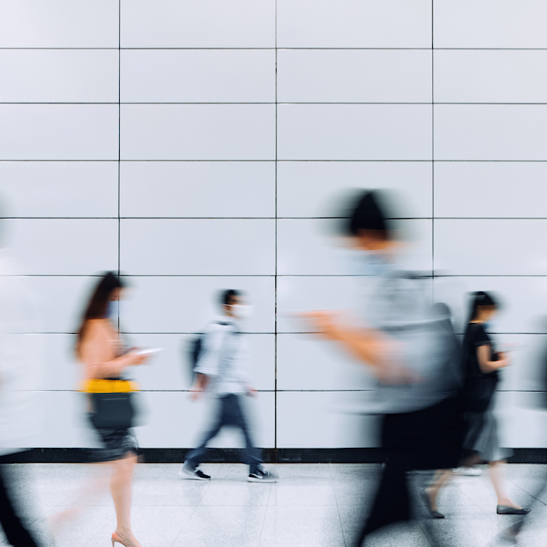 People walking to their destination fast