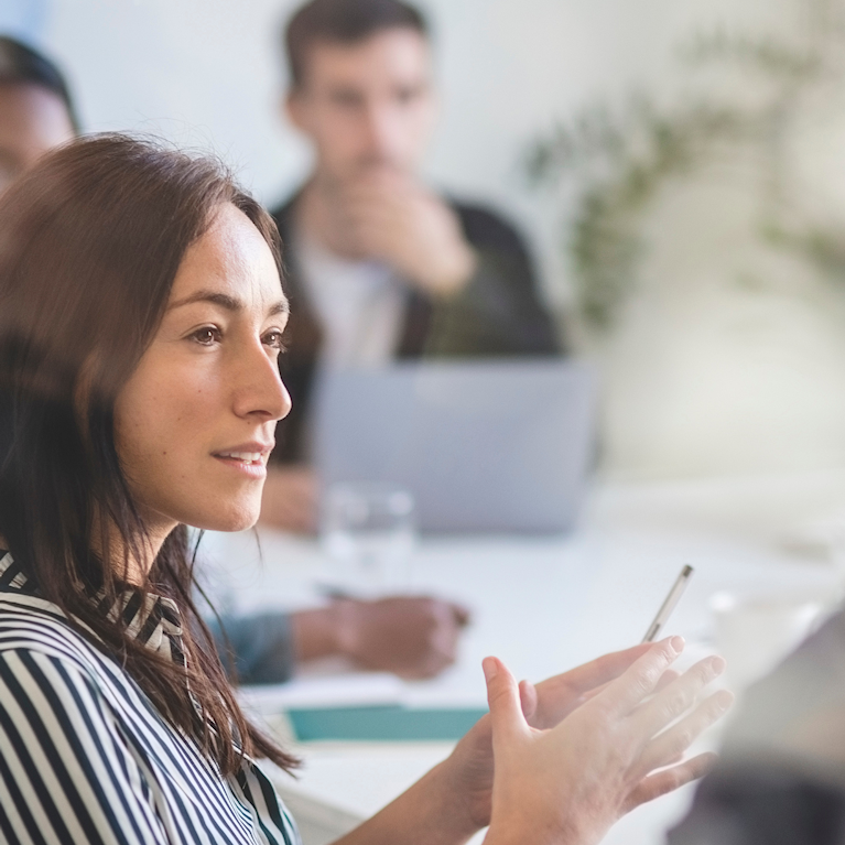 Woman talking in a team meeting